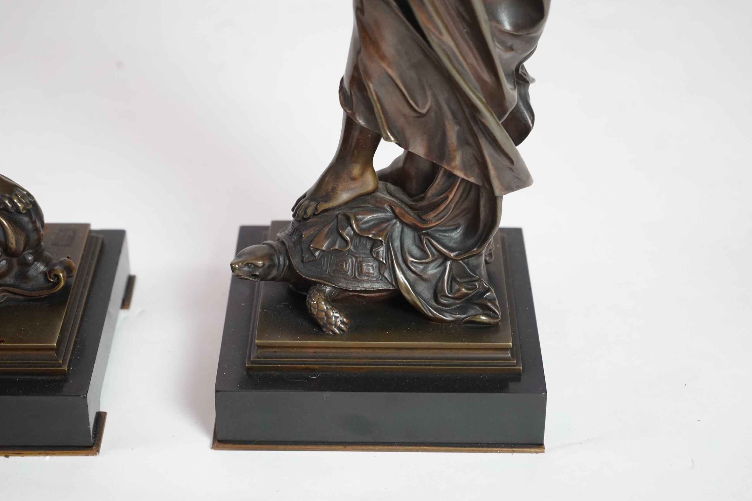 Eutrope Bouret, (French 1833-1906). A pair of late 19th century patinated bronze figures of Venus riding a dolphin and a nymph riding a tortoise